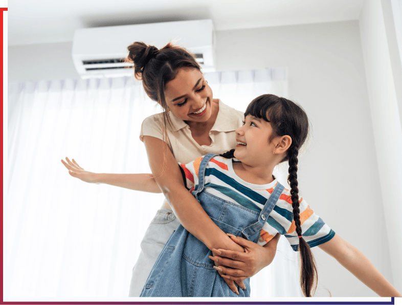 First Call Heating & Cooling ductless installation with happy mother and daughter.