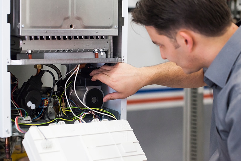 Technician working on a heat pump.